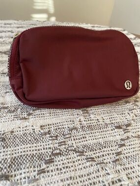 lululemon athletica Maroon Zip Pouch with Silver Logo